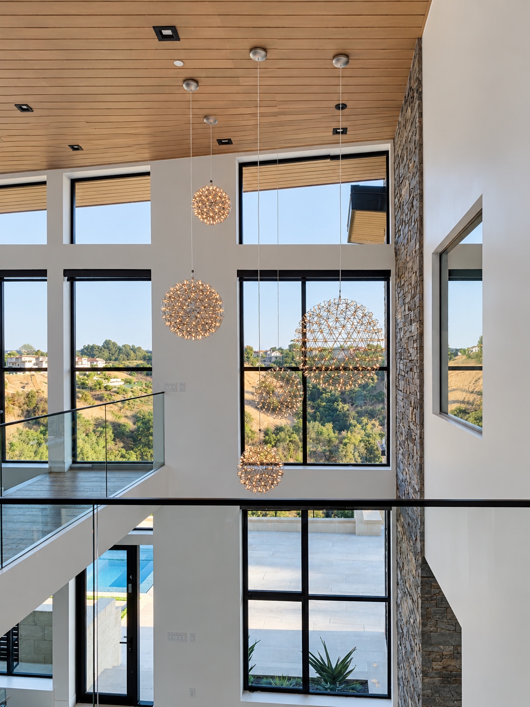 Timber ceiling and pendant lights above tall glazing — Diamond Bar, CA